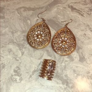 Hanging earrings and large ring